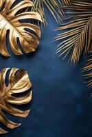 Golden tropical leaves against a dark blue background create an elegant decor theme photo