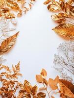 Elegant arrangement of dried flowers and golden leaves on a soft background photo