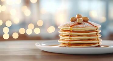 Stack of fluffy pancakes drizzled with syrup and topped with nuts on a rustic table photo