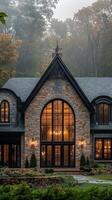 Elegant stone mansion surrounded by fog and autumn trees in a serene location photo