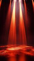 Red stage lights illuminate a performance area with glittering effects at a venue photo
