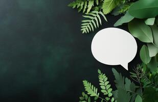 Green foliage with a blank speech bubble for creative messaging or design projects photo