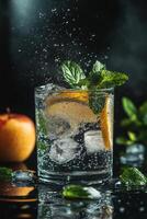 Refreshing drink with lemon and mint beside a fresh apple on a dark background photo