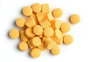 Dried yellow pasta pieces scattered on bright yellow background in a creative layout photo