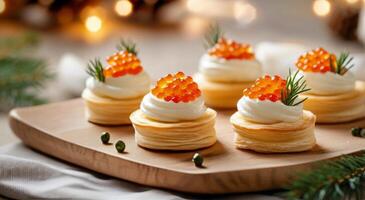 Delicate pastry cups filled with cream and topped with fish roe and herbs for a festive occasion photo
