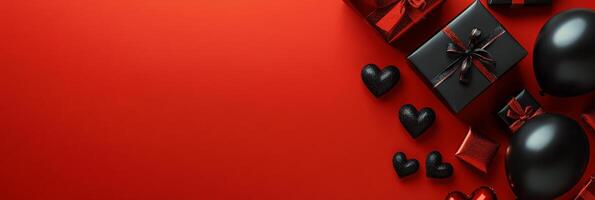 Decorative black balloons and gift boxes on vibrant red background for celebrations photo