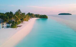 Serene sandy beach with clear turquoise water at sunset near tropical island getaway photo