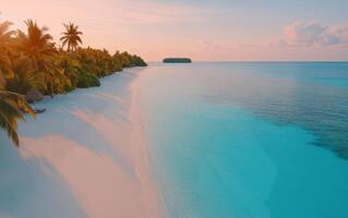 Serene sandy beach with clear turquoise water at sunset near tropical island getaway photo