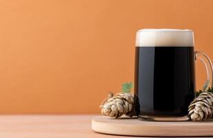 Dark beer served in a frosty mug with hops on a rustic surface photo
