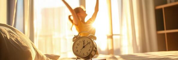 Morning routine of a woman joyfully waking up to the sunlight and a clock on her bedside table photo