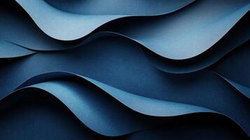 Textured blue waves of paper create an abstract design forming elegant curves and shapes photo
