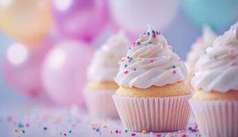 Delicious cupcakes with frosting and sprinkles at a pastel themed celebration photo
