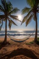 Relaxing hammock on the beach at sunset with beautiful clouds and ocean waves in the background photo