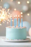 Children celebrate with a mint green birthday cake and sparklers at a joyful party setting photo