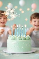 Children celebrate with a mint green birthday cake and sparklers at a joyful party setting photo
