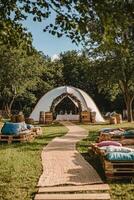 Charming outdoor event setup with a pathway, chairs, and decorative elements on a sunny day photo