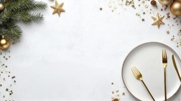 Elegant holiday table setting with white plate and golden utensils on a festive background photo