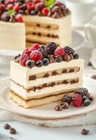 Delicious layered cake with mixed berries served on a plate during a delightful afternoon gathering photo