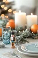 A festive table with candles, holiday decor, and a charming nutcracker on display photo