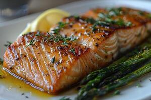 Close-up of Grilled Salmon with Asparagus and Lemon Wedge photo