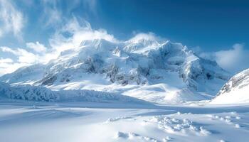 Snowy Mountain Range with Clear Blue Sky and Wispy Clouds photo