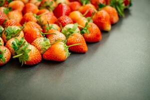 A group of strawberries are arranged in a row photo