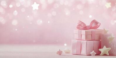 Colorful gift boxes with ribbons and stars on a pink sparkling background for festive celebrations photo