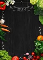 Design concept for restaurant menu mockup. Black rustic chalkboard with white inscription and vegetables frame, top view, copy space for text and logo, vegetarian cafe concept photo