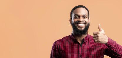 I Like It Concept. Headshot Closeup Portrait Of Smiling African American Guy Gesturing Thumbs Up At Camera. Confident Man Agree, Standing Isolated Over Yellow Background In Studio photo