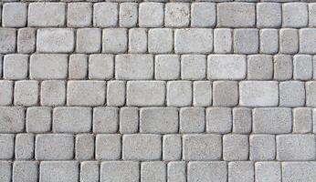 Stone paving texture. Abstract structured background of modern street pavement slabs pattern photo