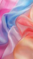 Soft and flowing pastel silk fabric draping gracefully in gentle folds photo