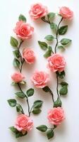 Beautiful pink roses arranged elegantly with green leaves on a light background photo