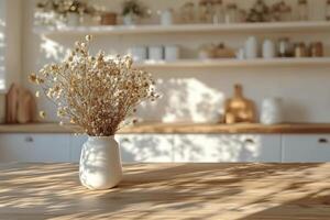 A serene kitchen setting featuring a vase of dried flowers on a wooden table during daylight photo