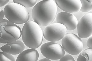 Fresh white eggs arranged neatly on a light surface for a culinary background or recipe photo