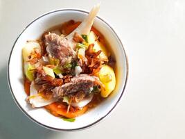 Flat Lay of Beef Soup with Vegetables photo
