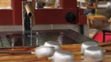 Purification trough at Asakusa shrine in Tokyo closeup video