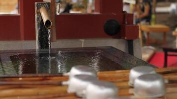 Purification trough at Asakusa shrine in Tokyo closeup video