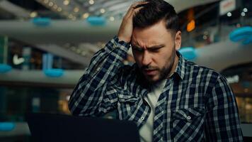 Disappointed depressed sad businessman freelancer caucasian man has problem with computer make mistake error send incorrect data read bad e-mail message upset male fail business deal bankruptcy defeat photo