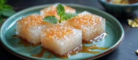Close Up of Thai Sweet Sticky Rice Dessert With Sweet Coconut Cream and Mint Garnish photo