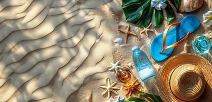 Beach Essentials Arranged on Sandy Shore With Sunlit Patterns photo