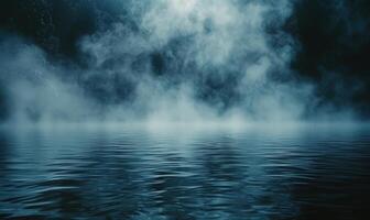 Moody Fog Over a Calm Blue Lake at Night photo