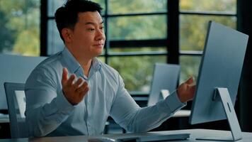 Chinese middle-aged businessman work on computer receive bad email notification wrong test result disappointed asian man business owner make mistake feel negative emotion professional defeat concept photo