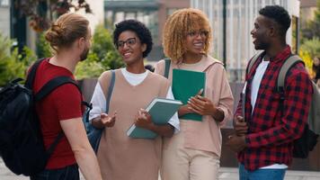 Diverse multiracial gen z friends happy smiling teens students pupils high school university college academy talking together laughing in city cuddling hugging conversation fun friendship education photo