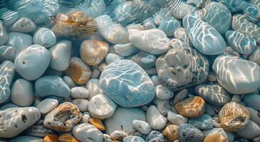 Smooth White And Blue Stones Under Clear Shallow Water On A Sunny Day photo
