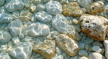 Smooth White And Blue Stones Under Clear Shallow Water On A Sunny Day photo