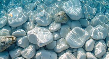 Clear Water Over Smooth, White Pebbles on a Sunny Day photo