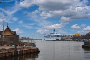 Helsinki Harbor with Docked Cruise Ship and Finnish Architecture photo