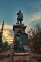 Johan Ludvig Runeberg Statue at Sunset in Esplanadi Park, Helsinki photo