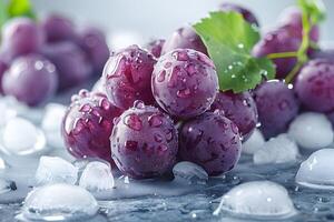 A close-up of fresh purple grapes with water droplets, surrounded by ice, creating a refreshing and appetizing appearance. photo