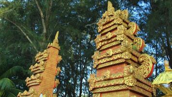 Balinese gate stands strong and beautiful in the afternoon photo